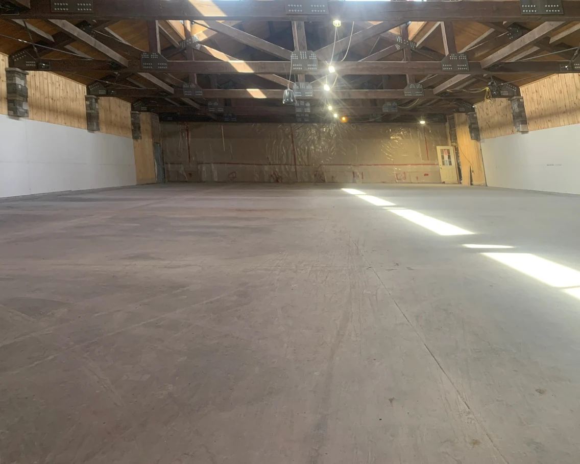 Event hall before: raw, unfinished concrete
