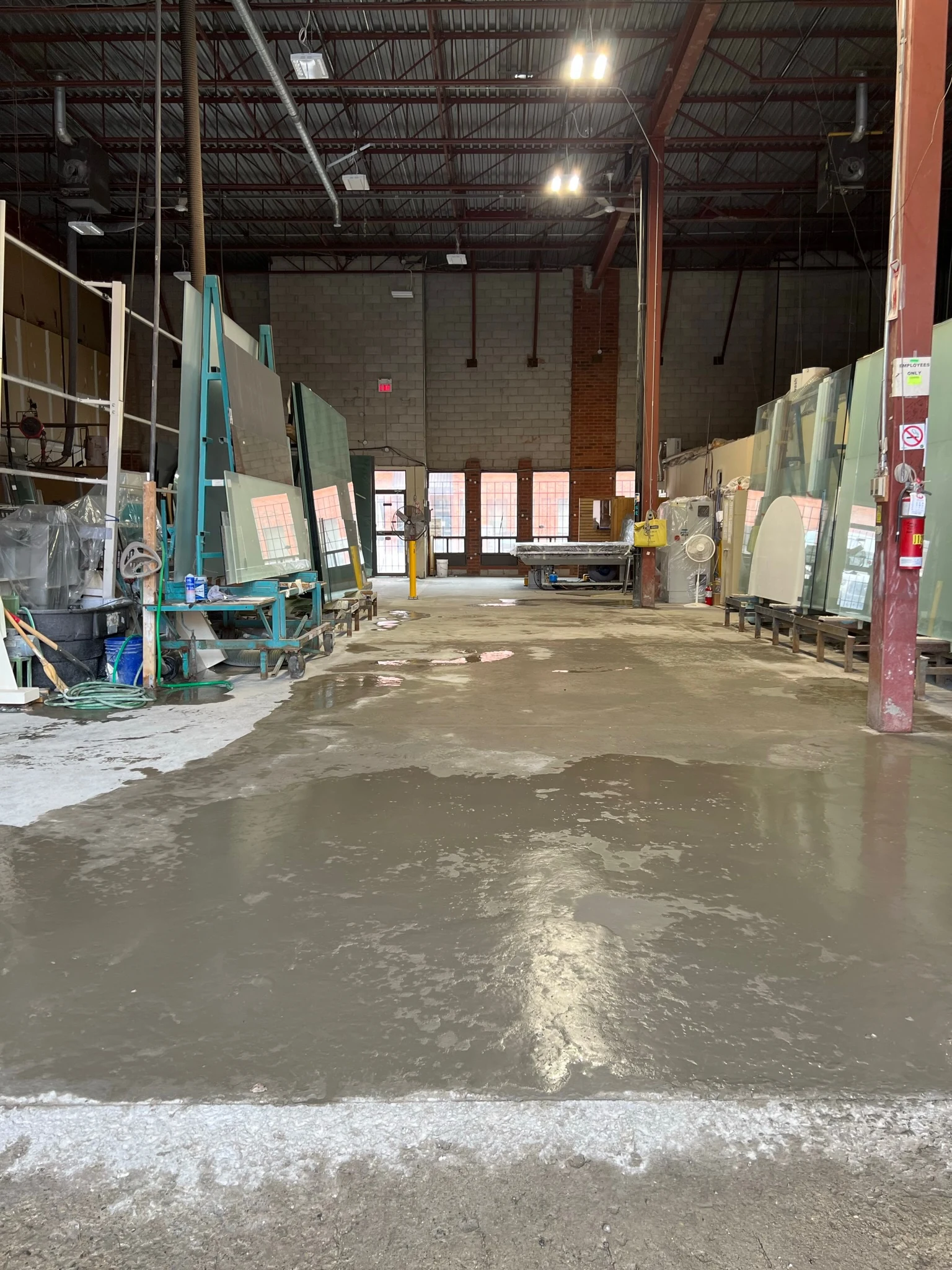 Freshly levelled and smoothed concrete floor in a warehouse